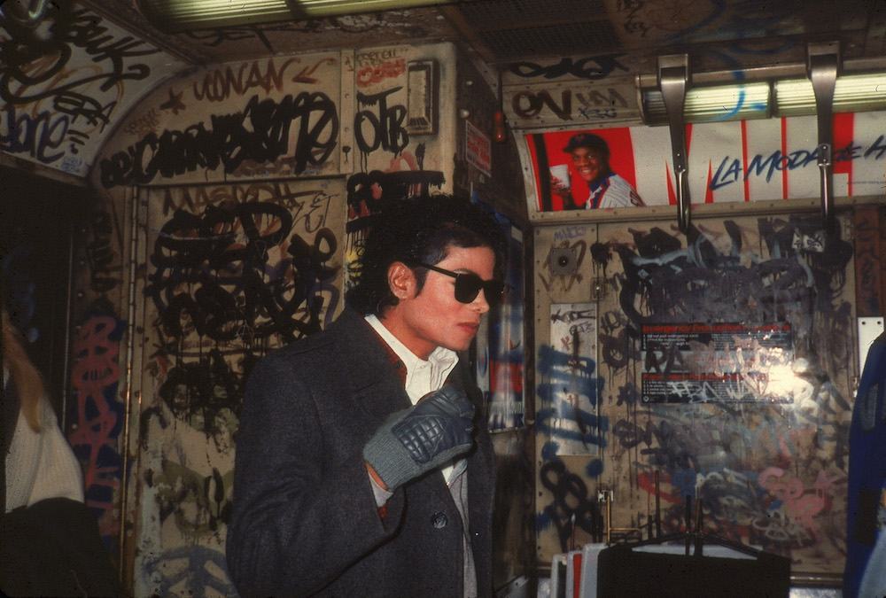Popular American musician Michael Jackson (1958 - 2009) stands in a graffiti-filled subway car during the filming of the long-form music video for his song 'Bad,' directed by Martin Scorsese, New York, New York, November 1986. (Photo by Vinnie Zuffante/Hulton Archive/Getty Images)