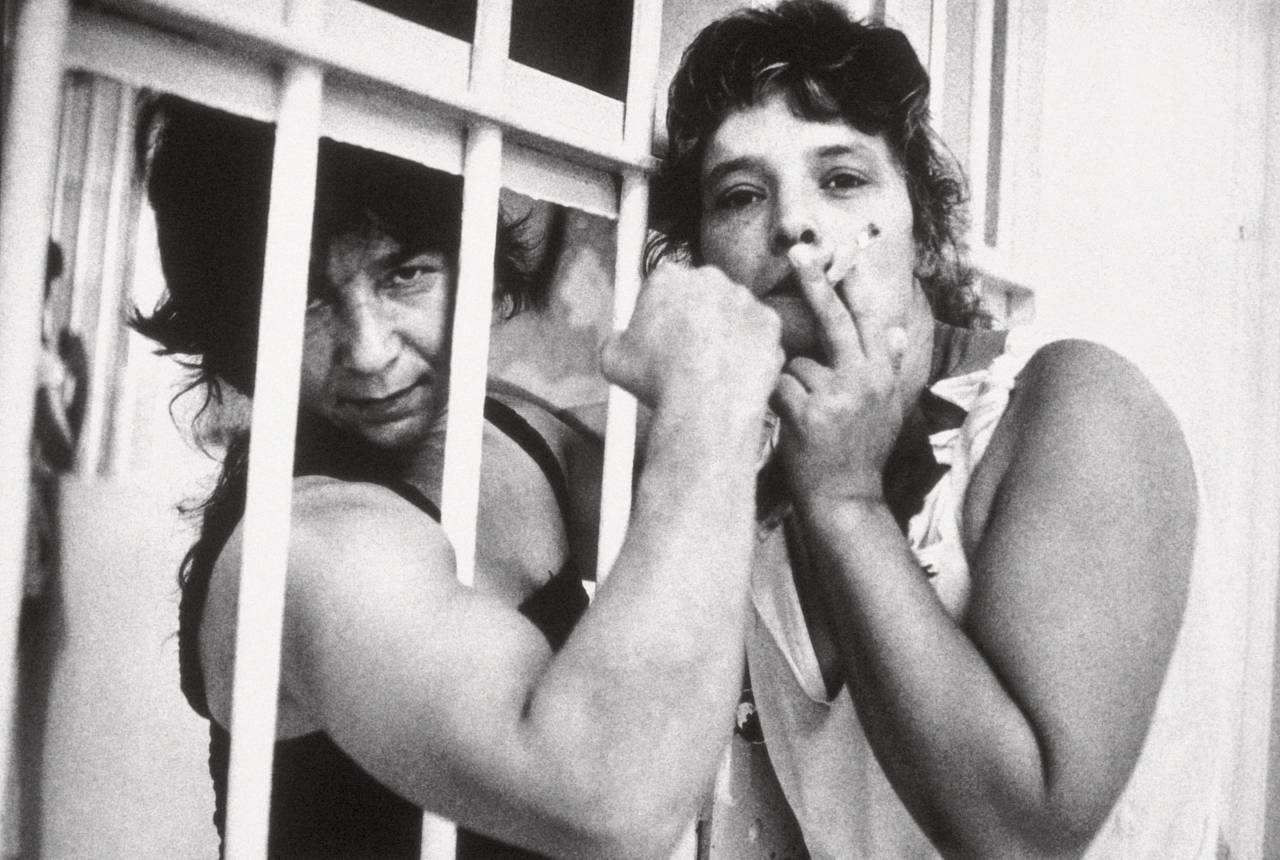 Imprisoned women One smokes, the other shows the strong muscles of the arms (Photo by Sofia Moro/Cover/Getty Images)