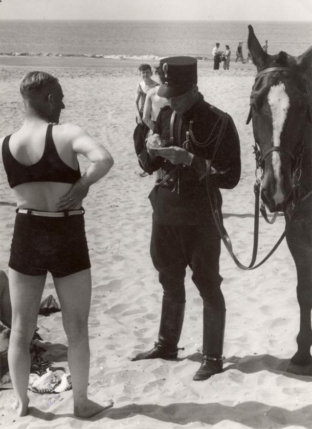  Man at the beach fined for not wearing decent clothes. Netherlands, Heemskerk, 1931.