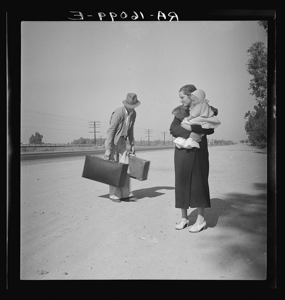 Young family, penniless, hitchhiking on U.S. Highway 99 in California. The father, twenty-four, and the mother, seventeen, came from Winston-Salem, North Carolina. Early in 1935, their baby was born in the Imperial Valley, California, where they were working as field laborers