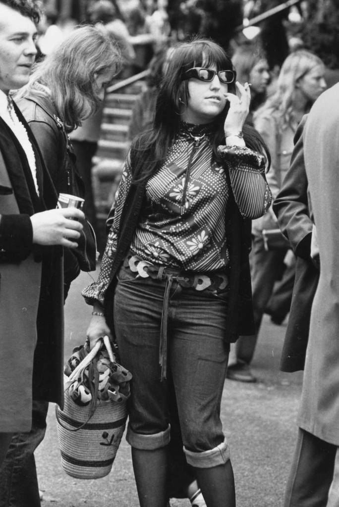 1972: A woman standing next to a teddy-boy sells leather belts at the Rock n' Roll Festival, Wembley Stadium. (Photo by Evening Standard/Getty Images)