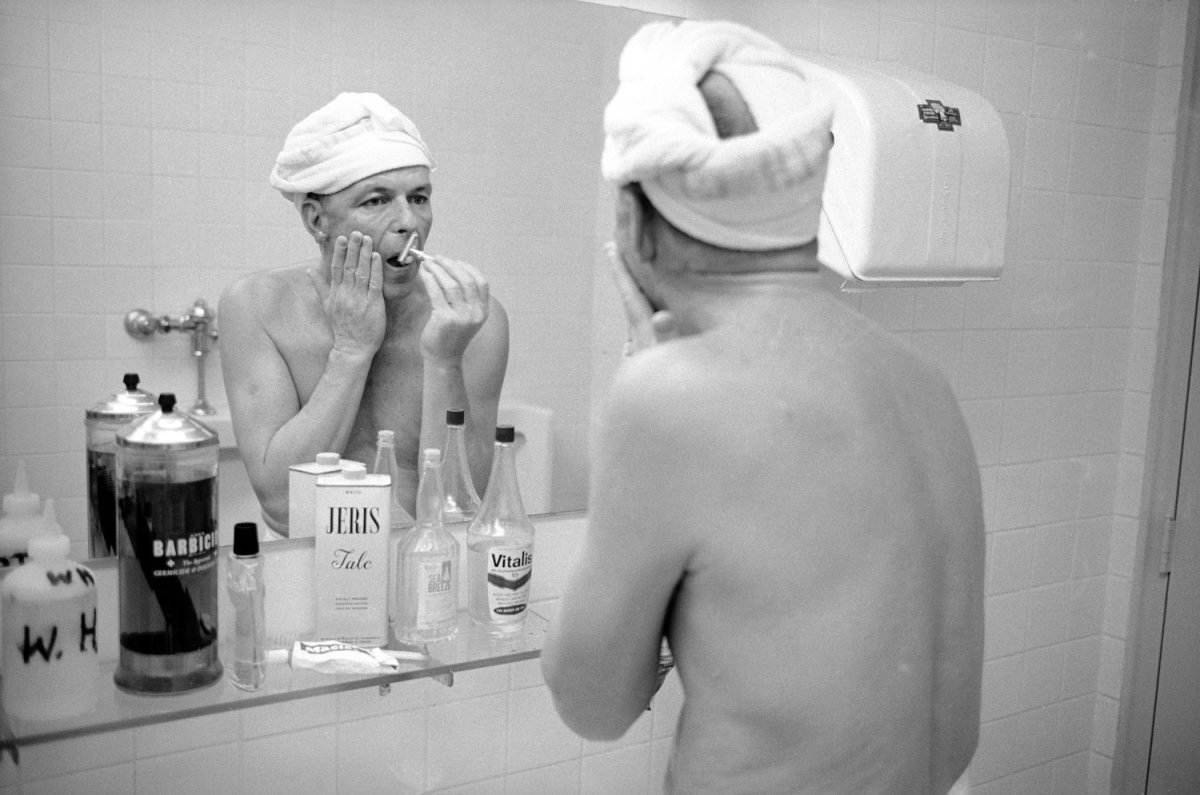 Frank Sinatra shaving. 1965 by John Dominis.