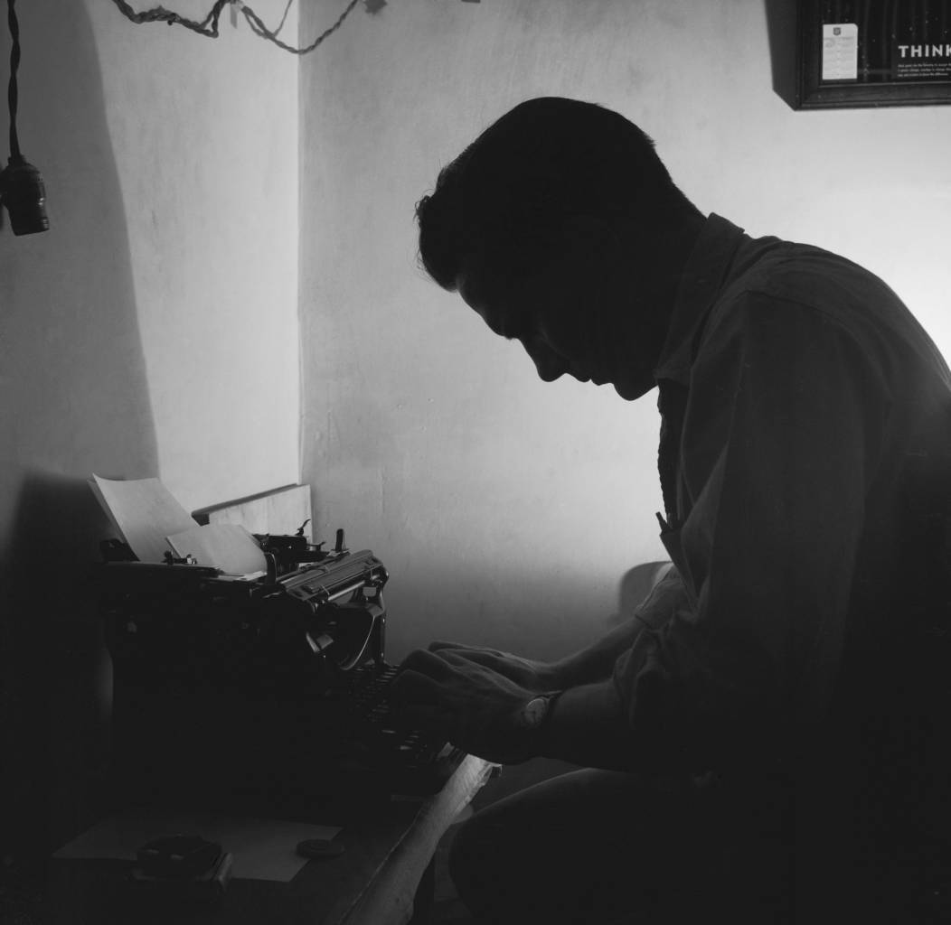 circa 1956: Prisoner Paul Harris types a letter in his cell at Iowa State Prison. (Photo by Three Lions/Getty Images)