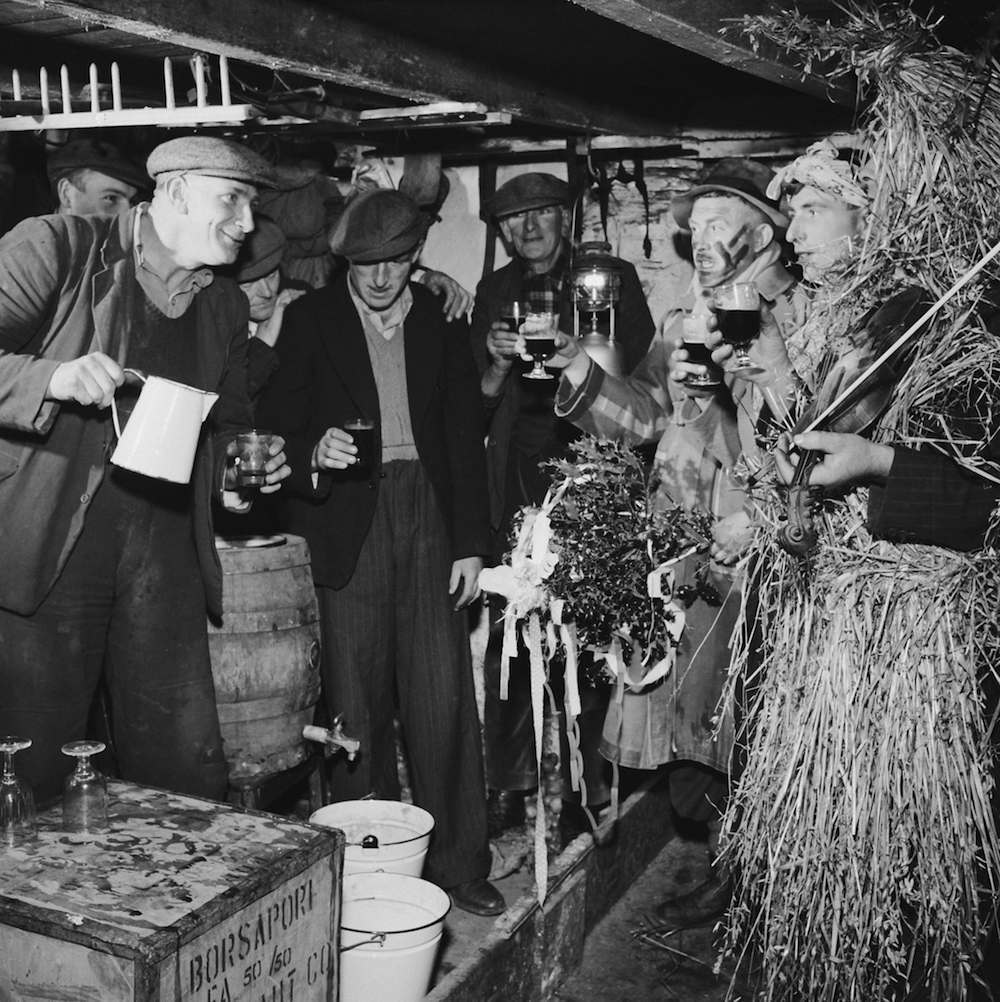 A group of mummers in Ireland celebrate St Stephen's Day or 'Wren's Day' on 26th December by processing from house to house with their instruments, and are rewarded with a glass of porter, circa 1955. (Photo by George Pickow/Three Lions/Hulton Archive/Getty Images)