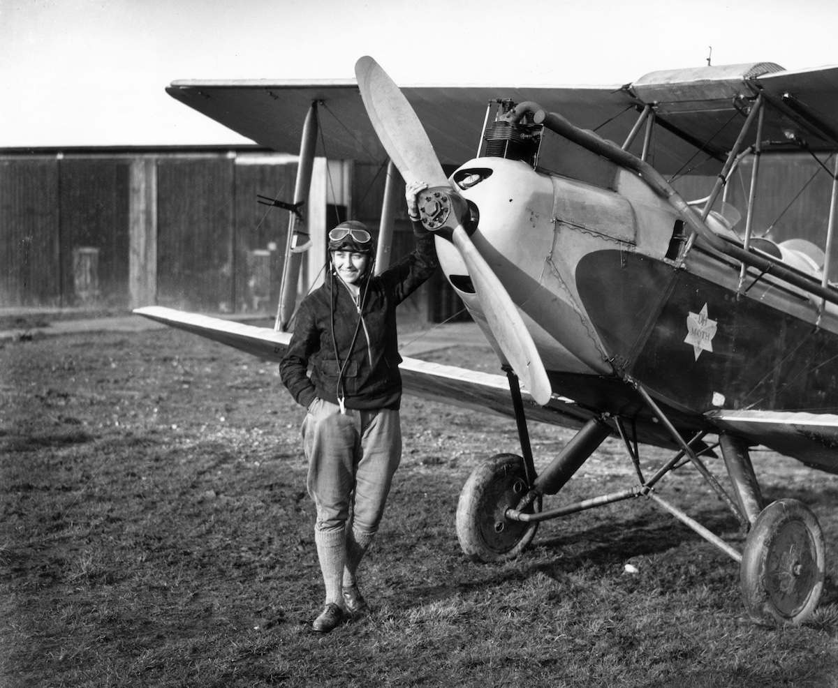5th May 1930: 26-year-old English aviator Amy Johnson (1903 - 1941) standing in front of her Gipsy Moth just before she undertook a 19-day solo flight to Australia. She died in 1941 when an aircraft she was ferrying crashed into the Thames estuary. (Photo by Central Press/Getty Images)
