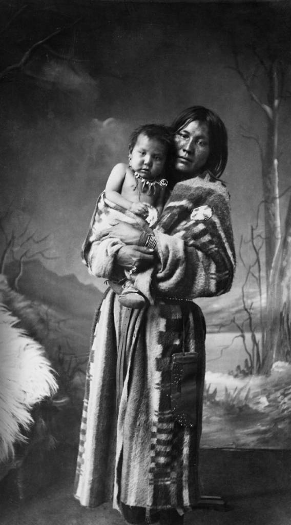 Sarcee (Tsuu T'ina) woman, Katie, and baby, Calgary, Alberta. Date: [ca. 1887]