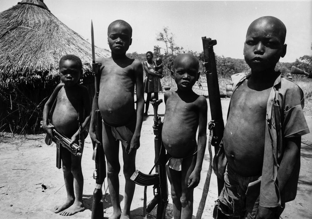 Children with guns during the civil war in southern Sudan. (Photo by John Downing/Getty Images)
