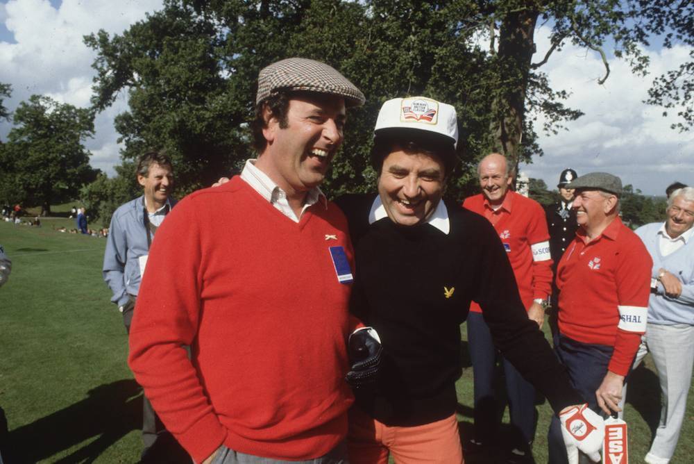 1981: Irish television and radio presenter, Terry Wogan, with the Liverpudlian comedian, Jimmy Tarbuck, during the Bob Hope British Classic golf tournament at Moor Park golf course. (Photo by Hulton Archive/Getty Images)