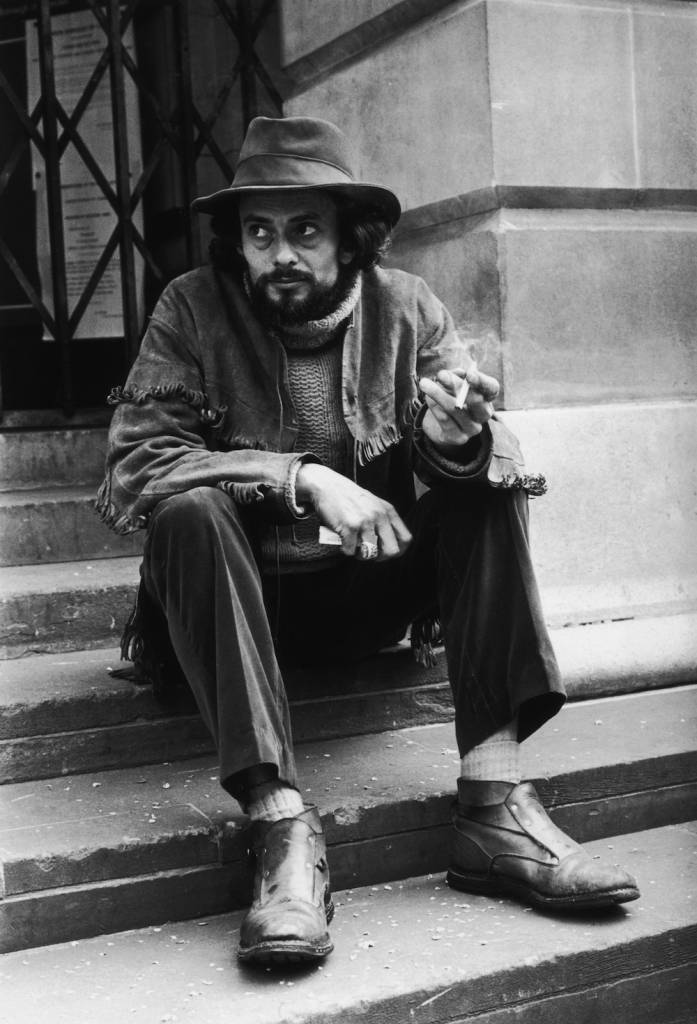 15th June 1968: Freelance photographer John 'Hoppy' Hopkins sits dejectedly on the steps of St Pancras Register Office, after his wedding to Suzy Creamcheese was postponed for the second time in two days. This time the bride failed to appear, due to suspected appendicitis. (Photo by Bob Aylott/Keystone/Getty Images)