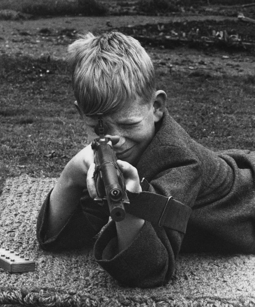 4th June 1941: A schoolboy takes careful aim during a gun class at his preparatory school in Maidenhead, Berkshire. (Photo by Fred Morley/Fox Photos/Getty Images)