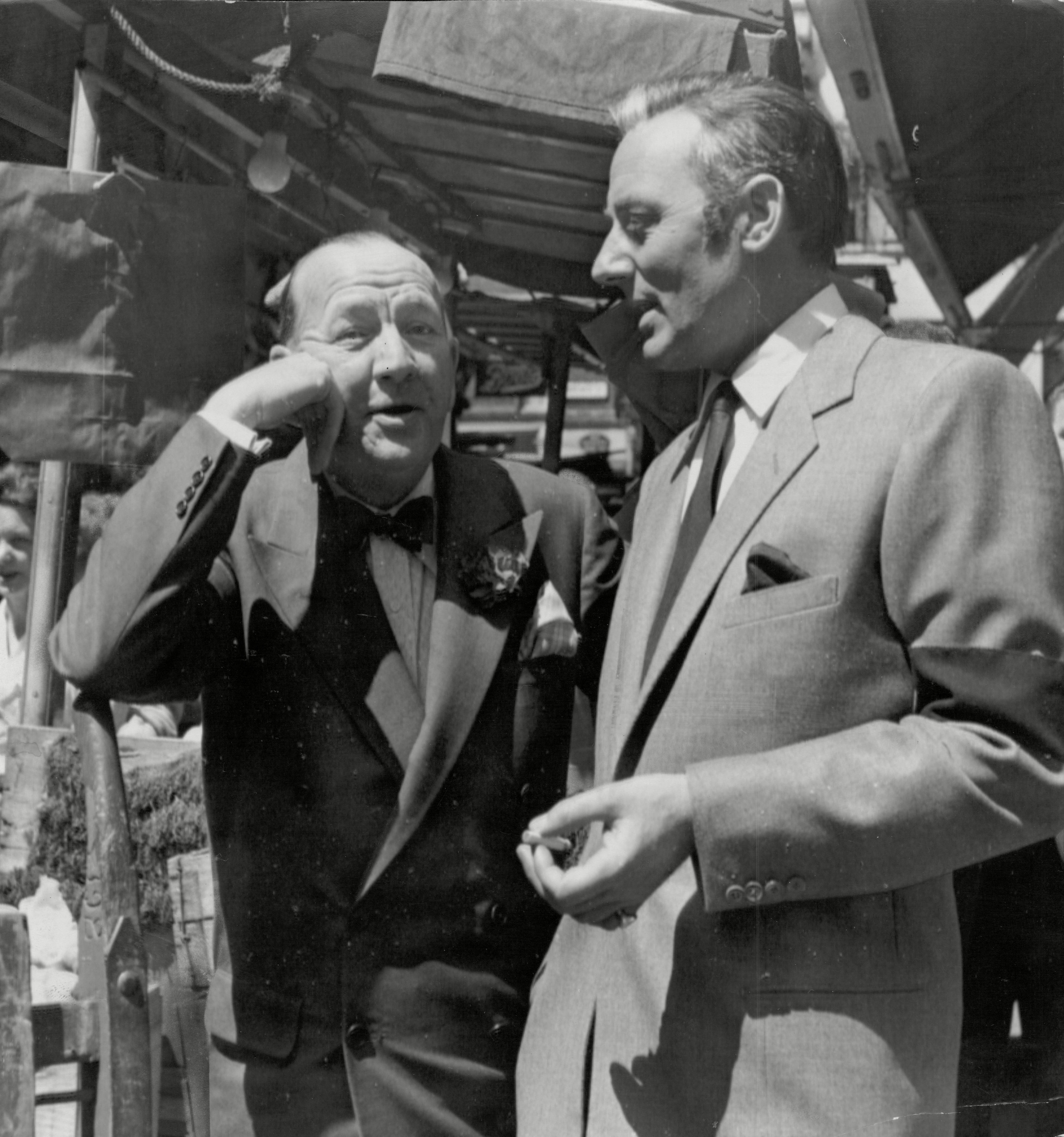 Noel Coward chats With Michael Wilding In Soho's Berwick Market Mandatory Credit: Photo by ANL/REX/Shutterstock