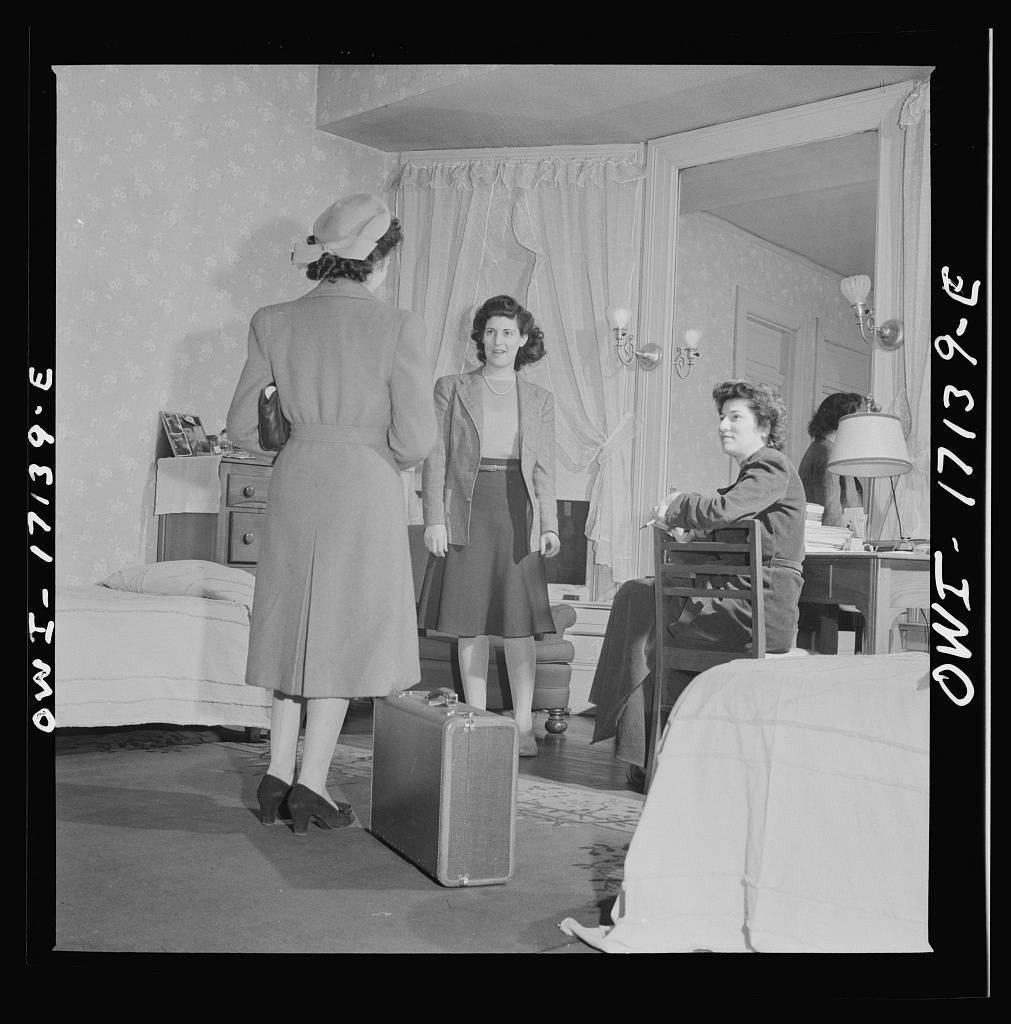Washington, D.C. A girl employed by the U.S. government, a new arrival at a boardinghouse, being greeted by her roommates