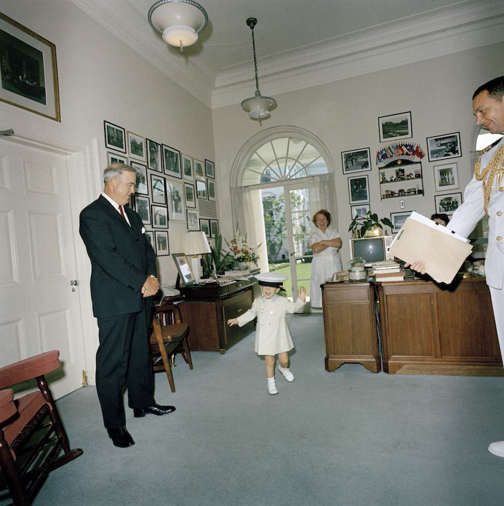 John F. Kennedy, Jr. Plays with Hat in White House