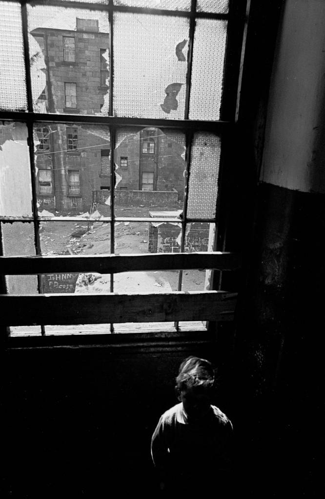 Child on a tenement staircase, Glasgow 1971
