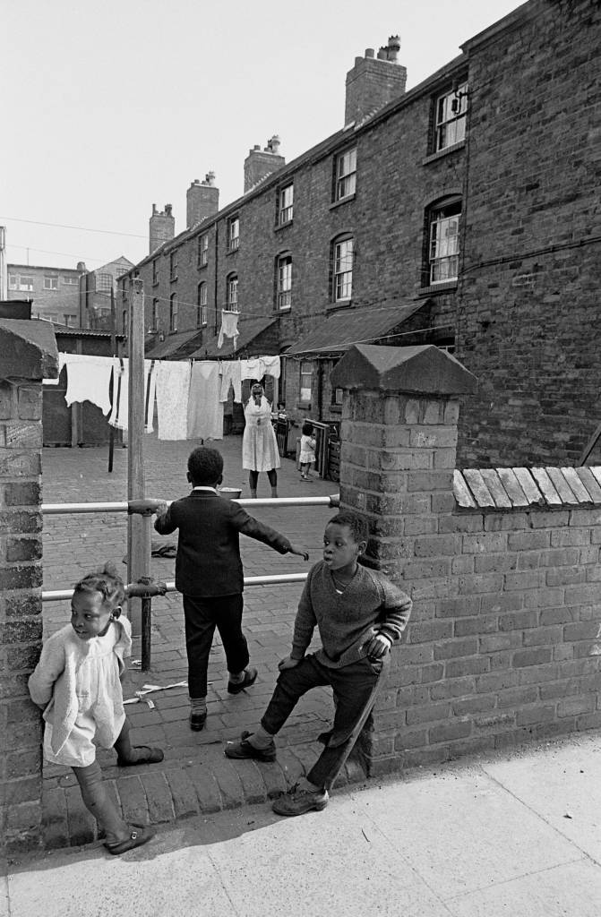 Children by back courtyard of their Aston home, 1969