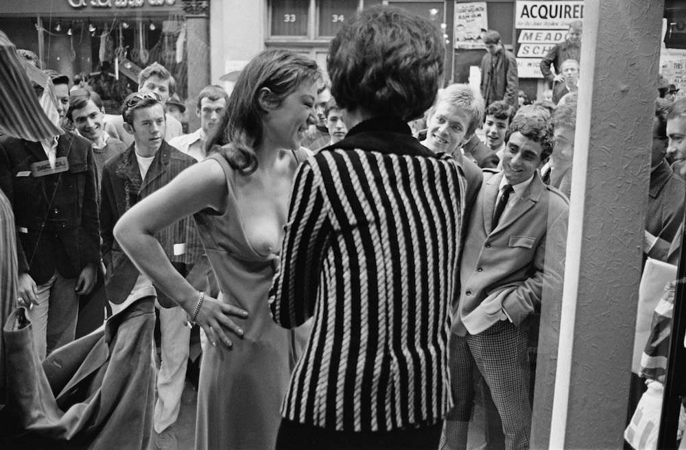 A model taking part in a risque photoshoot in the window of a new Henry Moss boutique in Carnaby Street, London, 11th May 1966. (Photo by John Downing/Daily Express/Hulton Archive/Getty Images)