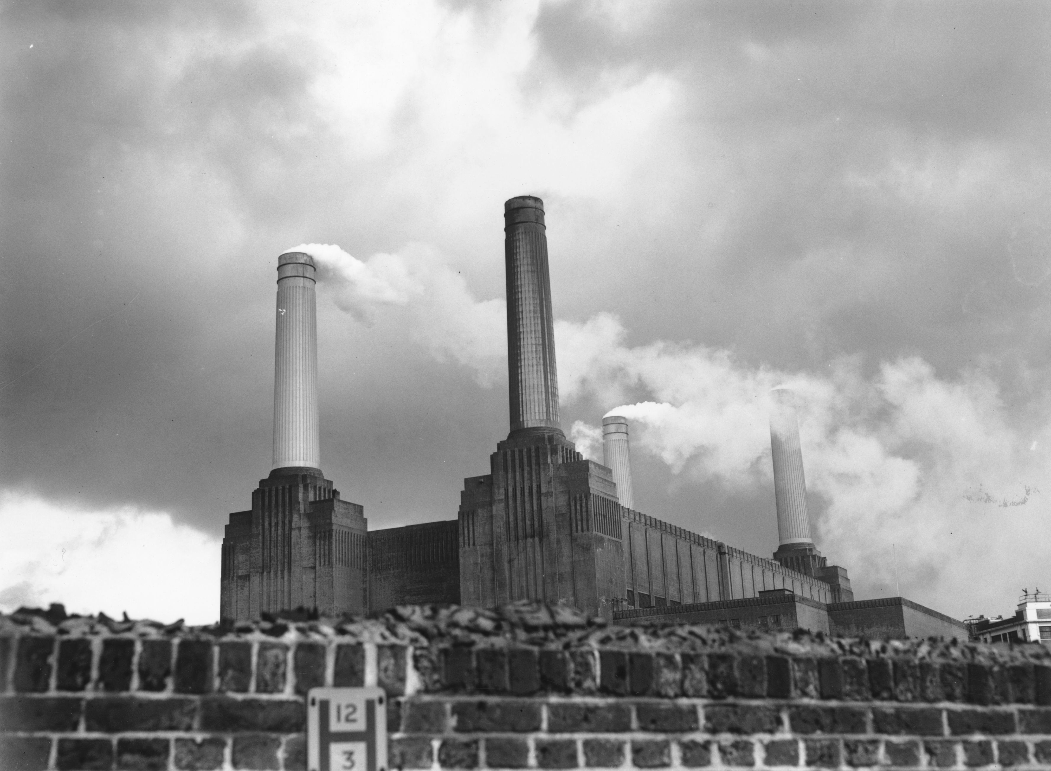 The Gothic-style towers of Battersea Power Station, on the bank of the River Thames. Designed by leading architect Giles Scott, the impressive building is due for closure in 1983. (Photo by Hales/Getty Images)