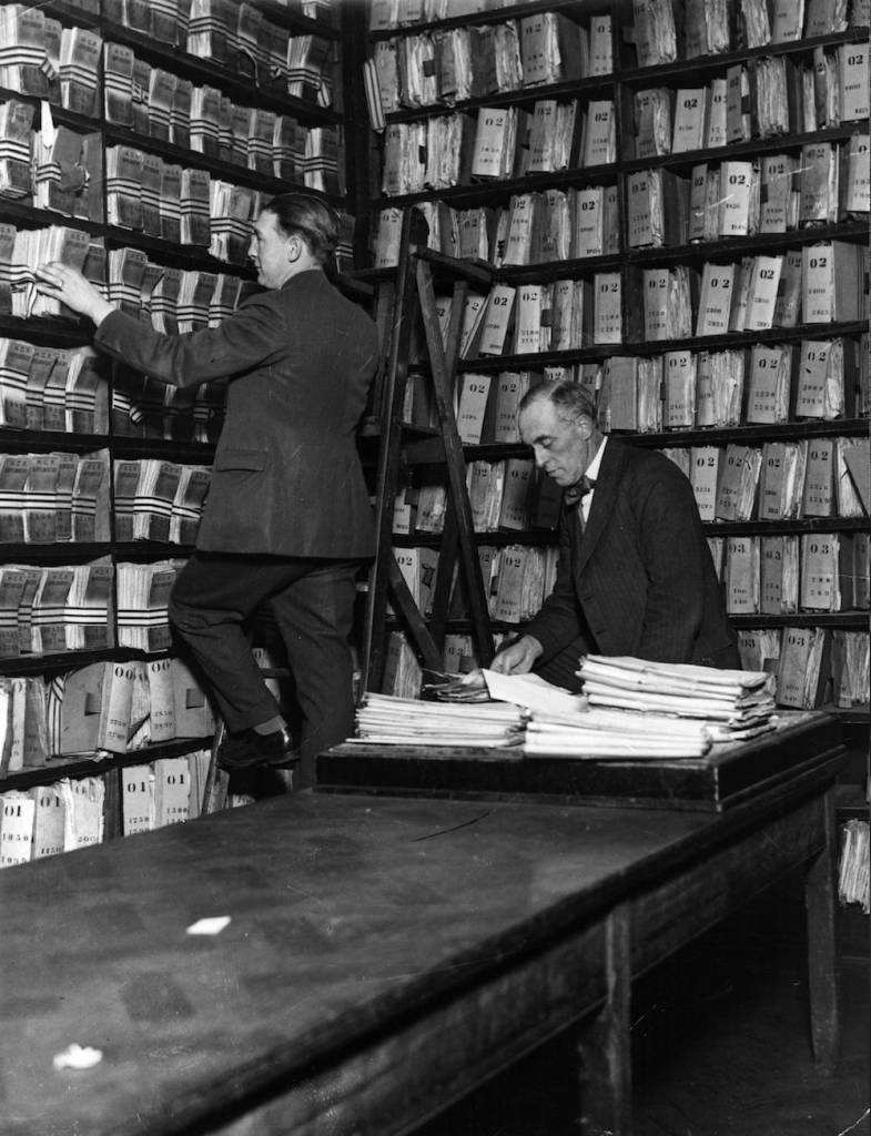 circa 1930: File shelves in the criminal record room at Scotland Yard, headquarters of the Metropolitan Police, London. (Photo by Three Lions/Getty Images)