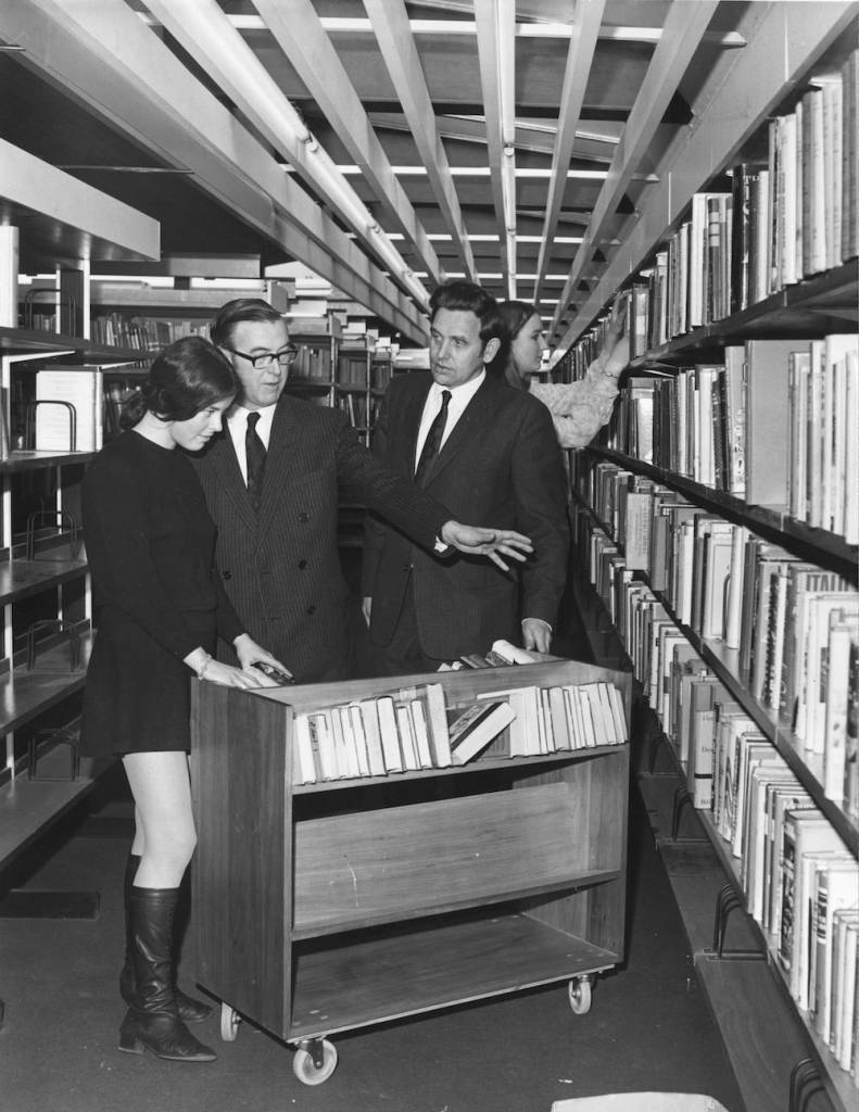 9th April 1969: A library assistant is instructed by Mr KR McColvin, borough Librarian, and Mr L Barby, Resident Librarian, at Lambeth Councils new, show-piece, library, which is to be opened by Princess Margaret. (Photo by Harry Todd/Fox Photos/Getty Images)