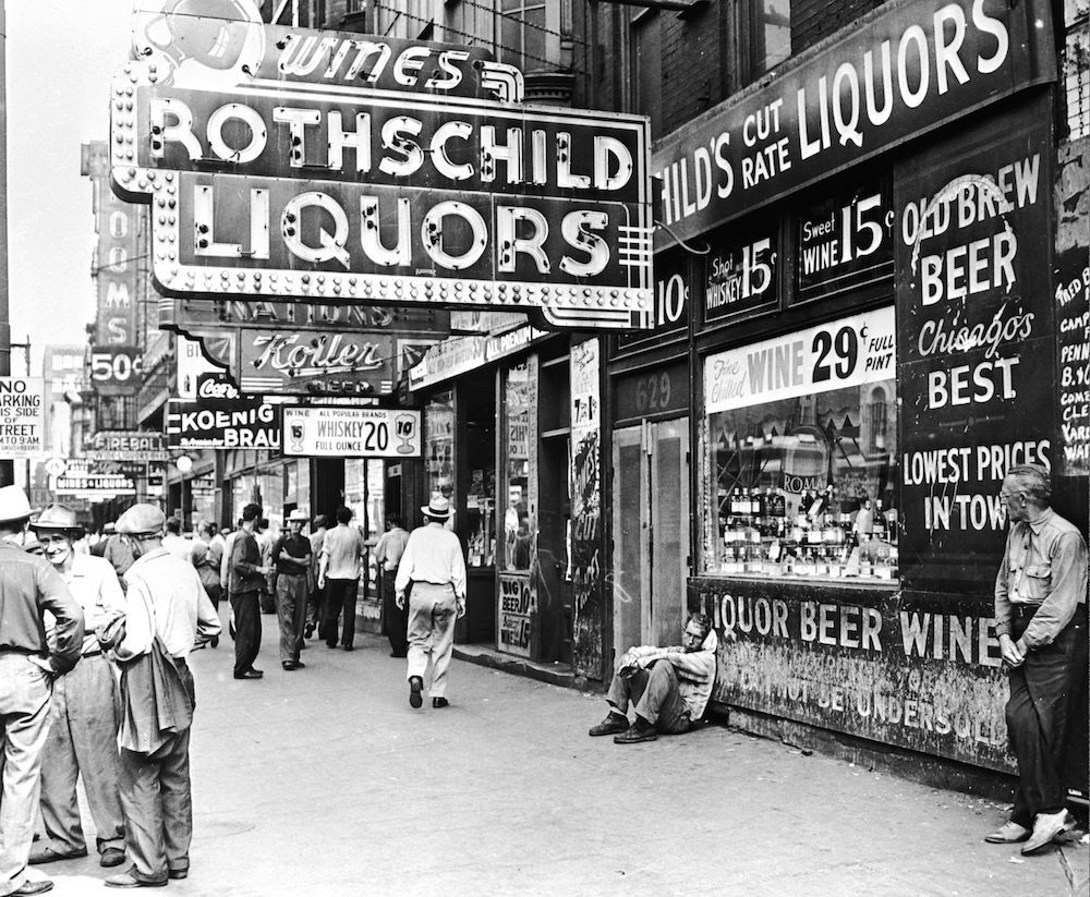 circa 1950: No less than six liquor stores can be seen in this Chicago street. In an area known for its derelict population, the city fathers, goaded by public indignation, will sometimes close down a number of these places. (Photo by Three Lions/Getty Images)