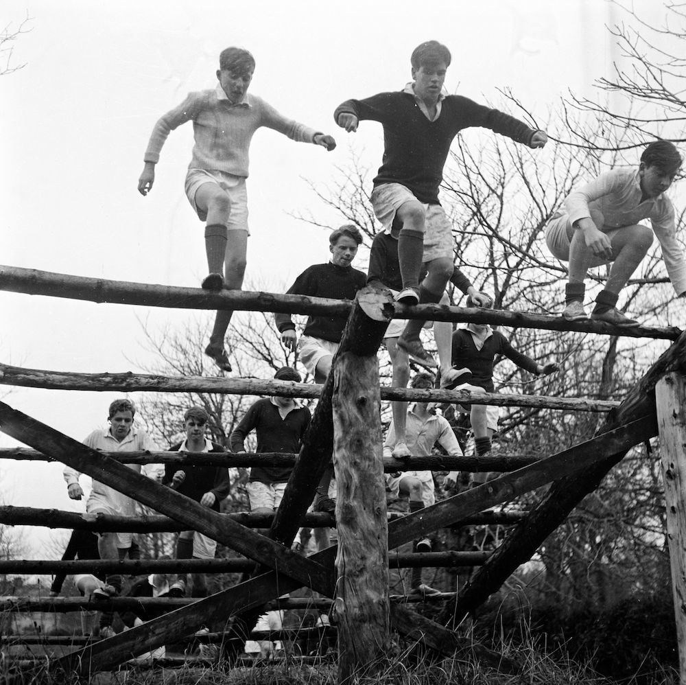 7th February 1956:  Pupils at Gordonstoun School doing physical training on an obstacle course. Gordonstoun School, near Elgin, was founded in 1934 by German educationalist Kurt Hahn who believed in a holistic approach to teaching. Creative and personal development, considered of equal merit to traditional education, is encouraged among the pupils.  (Photo by Chris Ware/Keystone Features/Getty Images)
