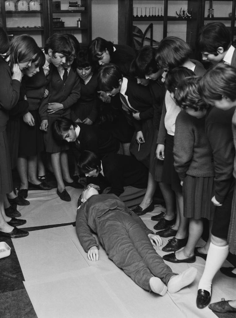 Pupils at the newly-opened Tower Hamlets Girls Comprehensive School (later the Mulberry School for Girls) in East London use a dummy to practise Cardiopulmonary Resuscitation or CPR, 7th January 1966. (Photo by Harry Todd/Fox Photos/Getty Images)
