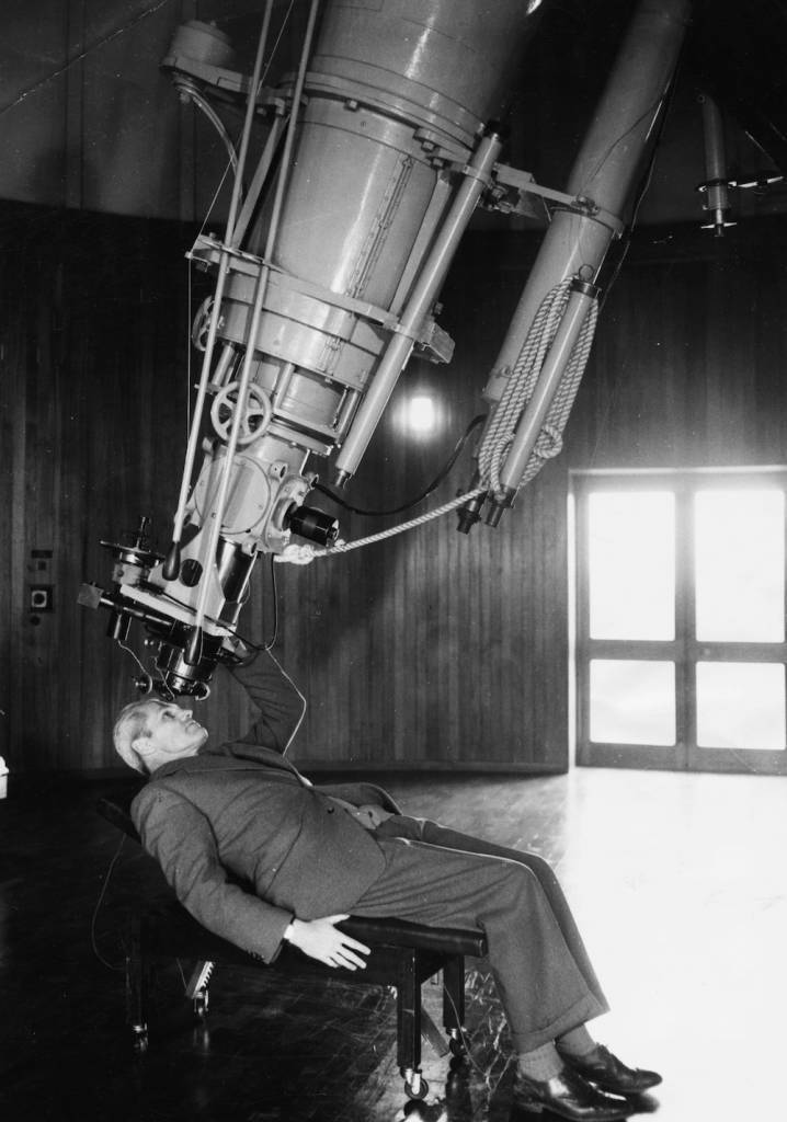 Portrait of Richard van der Riet Woolley, new Astronomer Royal, reclining back as he looks through a giant equatorial telescope, at Greenwich Observatory, Herstmonceux Castle, July 7th 1956. (Photo by Douglas Miller/Keystone/Getty Images)