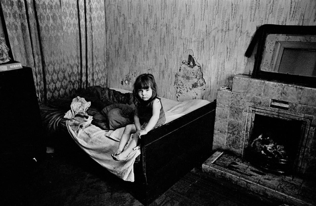 Glasgow 1970 A child in damp, semi-derelict tenement flat