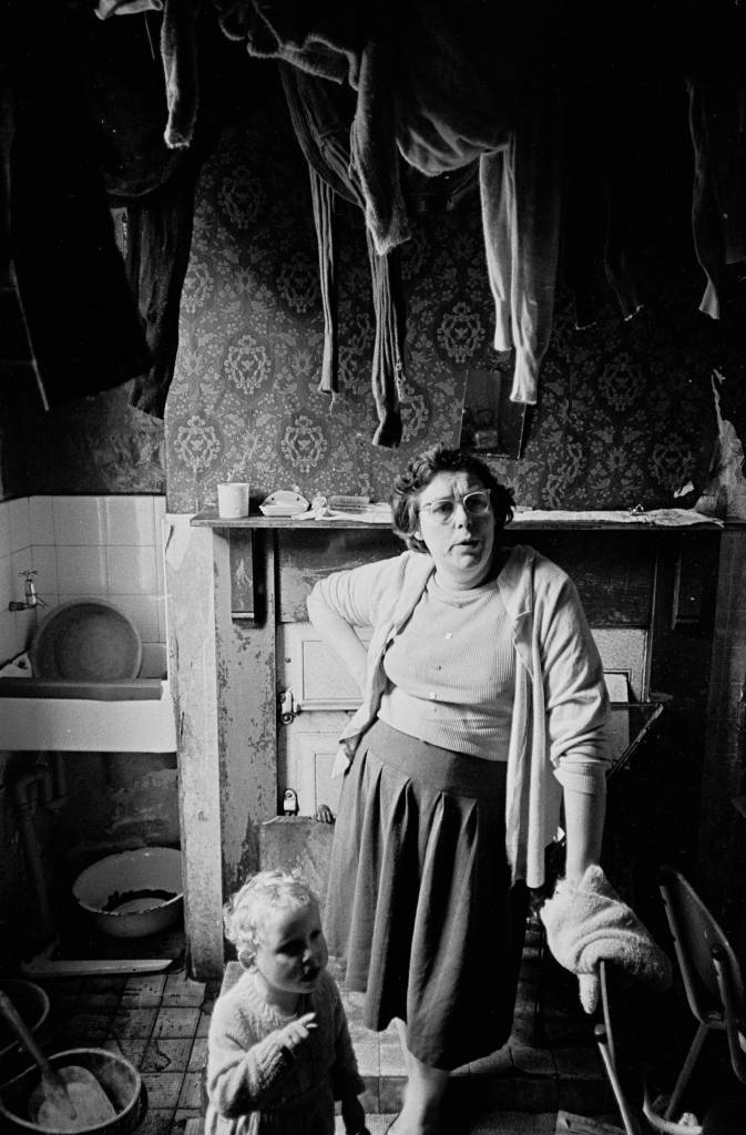 Mother and toddler in kitchen of slum property, Bradford 1969 26-36 ...