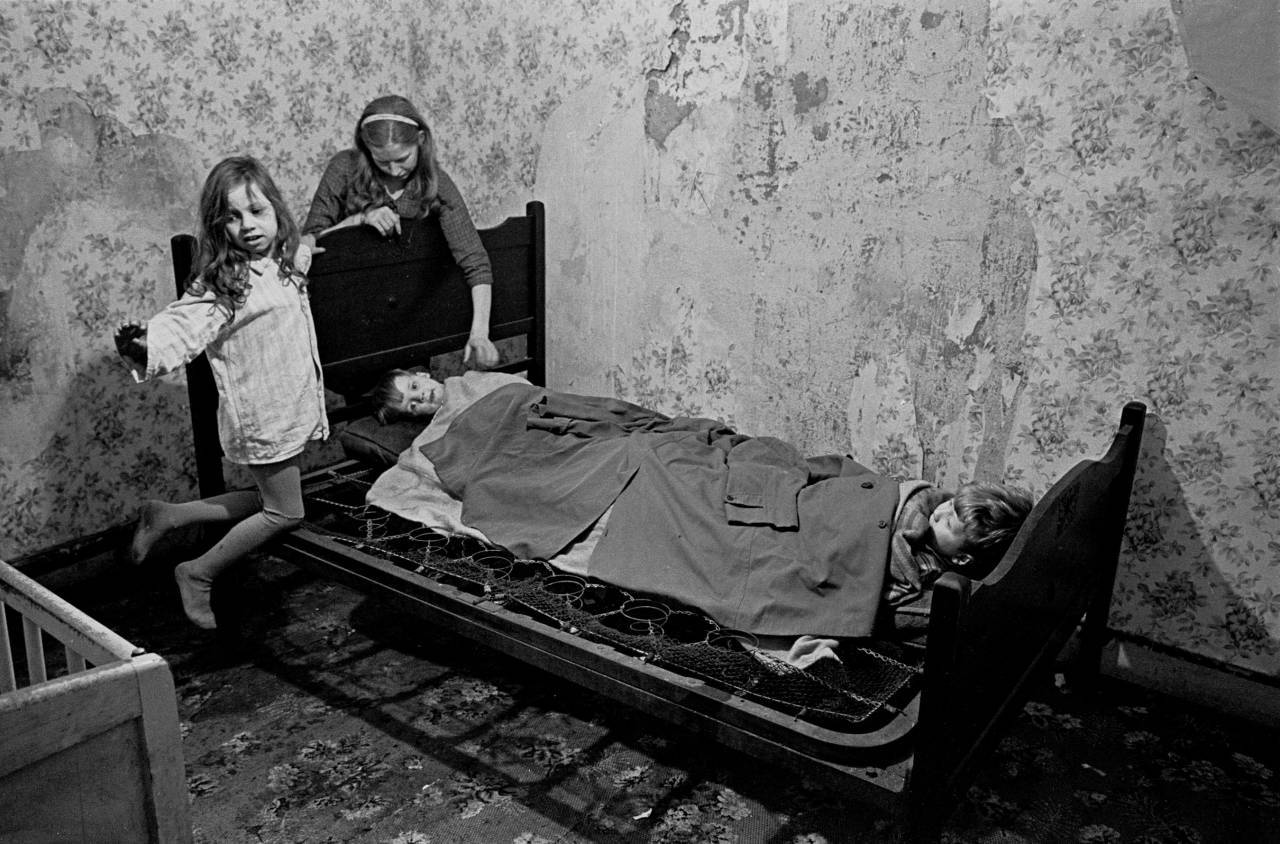Mrs Milne putting her children to bed Balsall Heath 1968