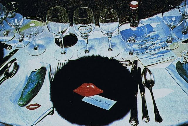 1972 Surrealiste Ball Detail of a table with a fur dish, Mae West red lips and a blue bread