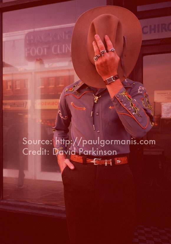 Previously unpublished shot of model in The Emperor Of Wyoming embroidered shirt, Stetson, belt and tie for Club International, spring 1973