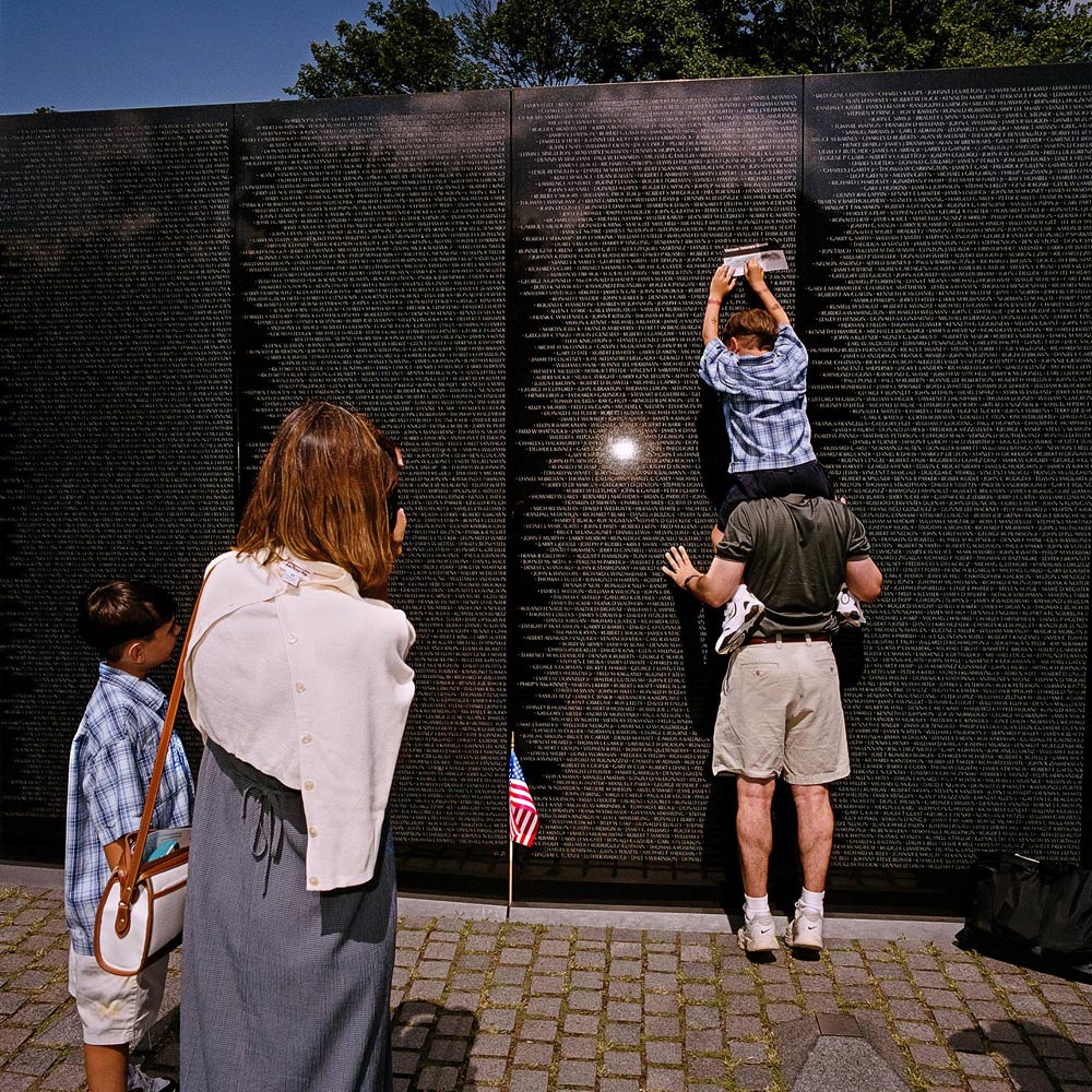 Family-Taking-Rubbing-at-Vietnam-Memorial-on-The-Mall-Washington-DC-2000