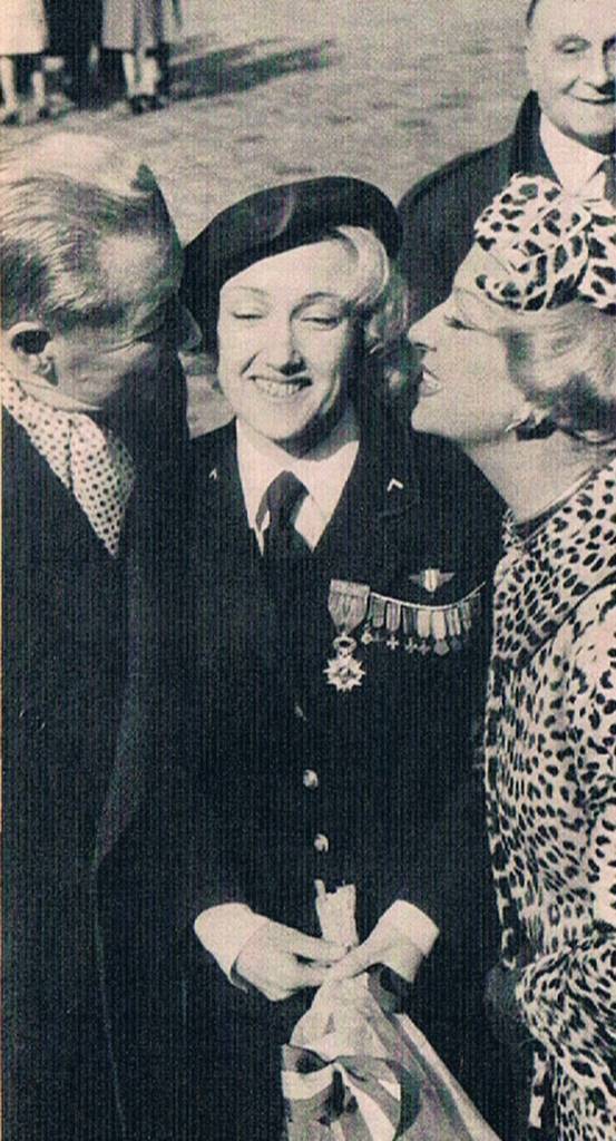 M. and Mme. Paul Derval owners of the Folies Bergere embrace Lydia when she received the Croix de Guerre.