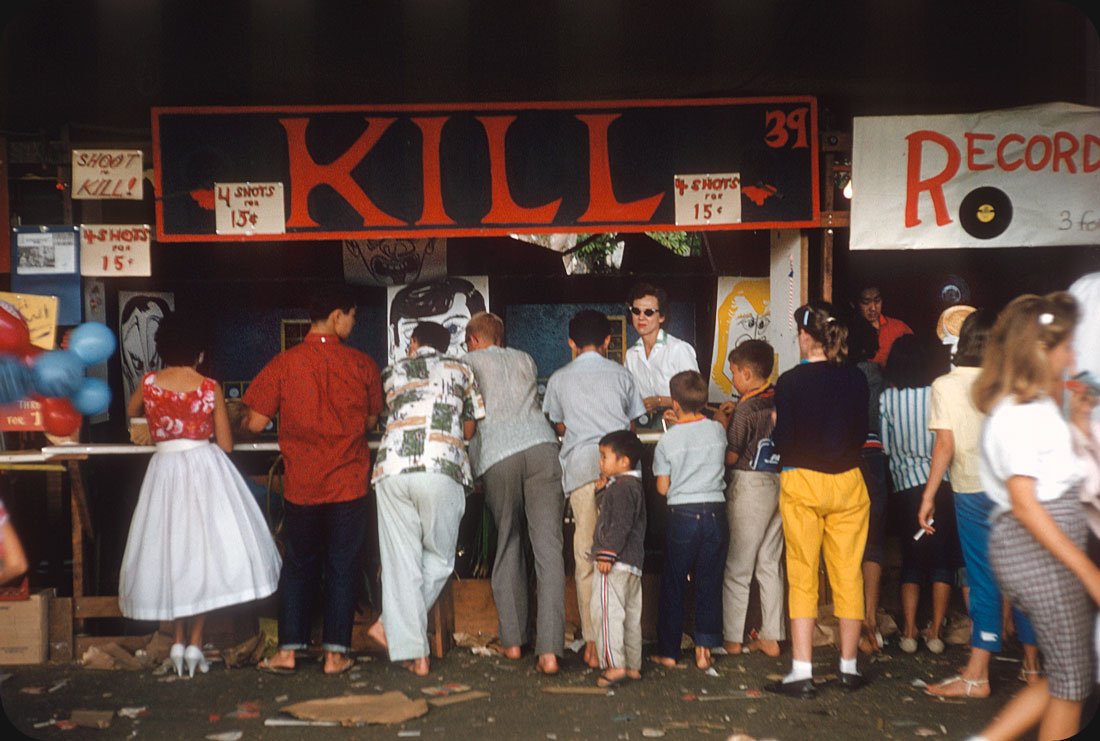 Shoot to Kill! — 1950s 4 shots ¢.15. Next door is "Record Smash". Street fair, Hawaii.