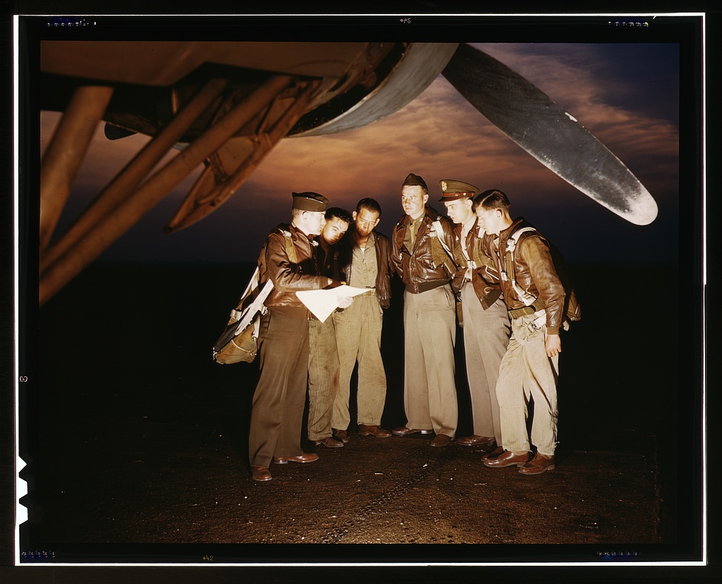 Here's our mission. A combat crew receives final instructions just before taking off in a mighty YB-17 bomber from a bombardment squadron base at the field, Langley Field, Va.