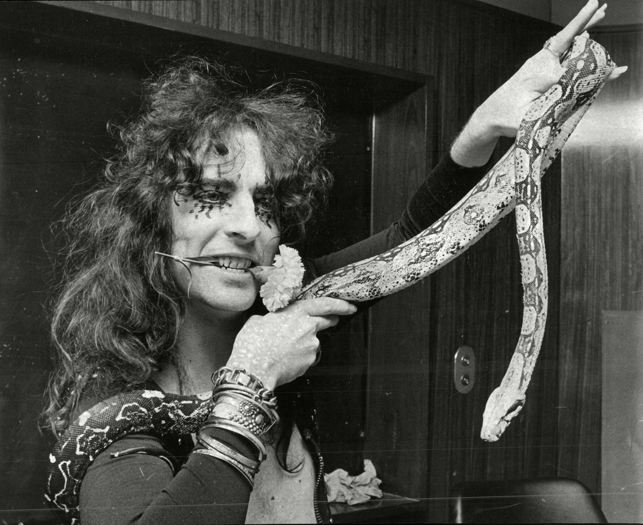 Mandatory Credit: Photo by ANL/REX/Shutterstock (3899101a) Alice Cooper American Pop Star With His Snake Katrina At London Airport. Alice Cooper American Pop Star With His Snake Katrina At London Airport.