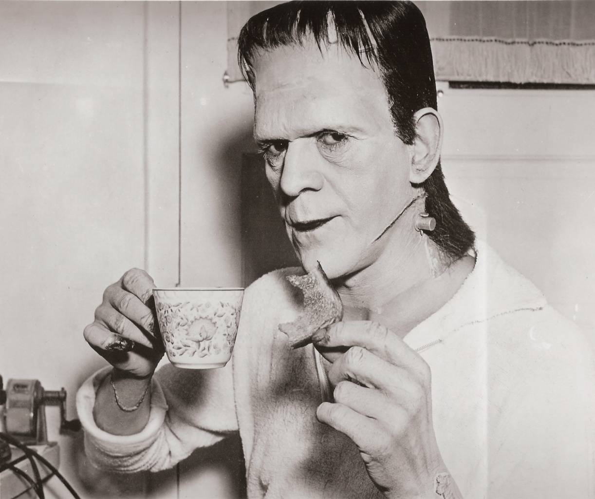 Boris Karloff having a nice cup of tea and a piece of toast between shots of Frankenstein, released in 1931.