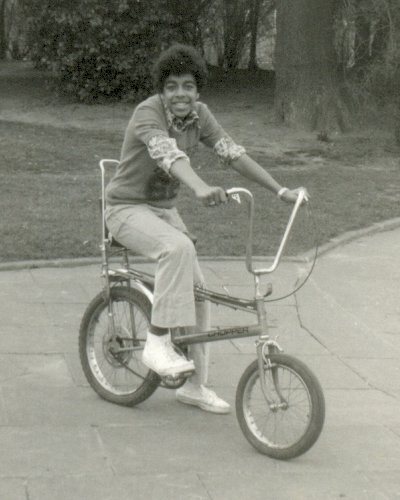 Tony on a Chopper which was the coolest bike in Britain to have in the mid-70s. The Raleigh Chopper was a wheelie bike, manufactured in the 1970s by the Raleigh Bicycle Company of Nottingham, England. Its unique design became a true 70s cultural icon. The Chopper bike was based on the look of a customised chopper motorcycle, made popular with films such as Easy Rider, and it was the "must have" item and signifier of coolness for many kids at the time.