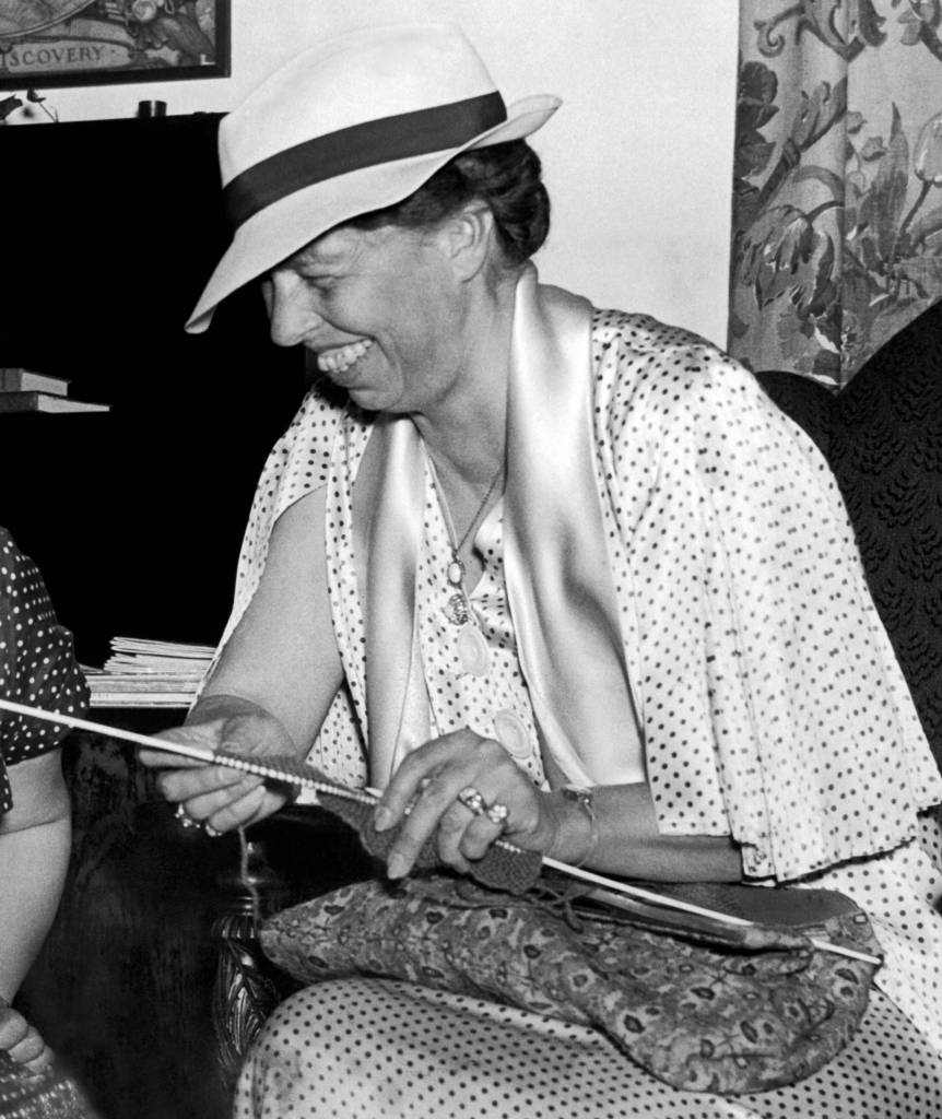 Washington, D.C.: June 2, 1936. Eleanor Roosevelt tried her hand at knitting at the Associated Country Women Of The World's exhibit at their triennial convention.