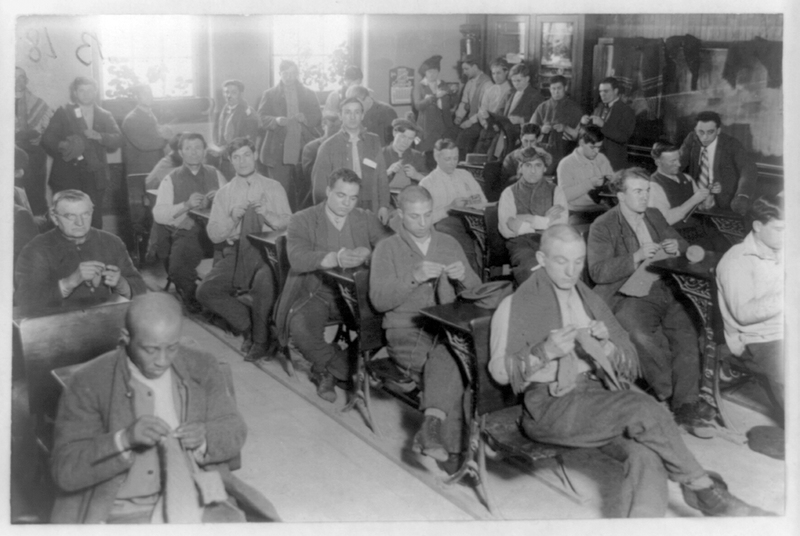 Prisoners knitting in one of their classrooms, Sing Sing prison, Ossining, New York, c. 1915.