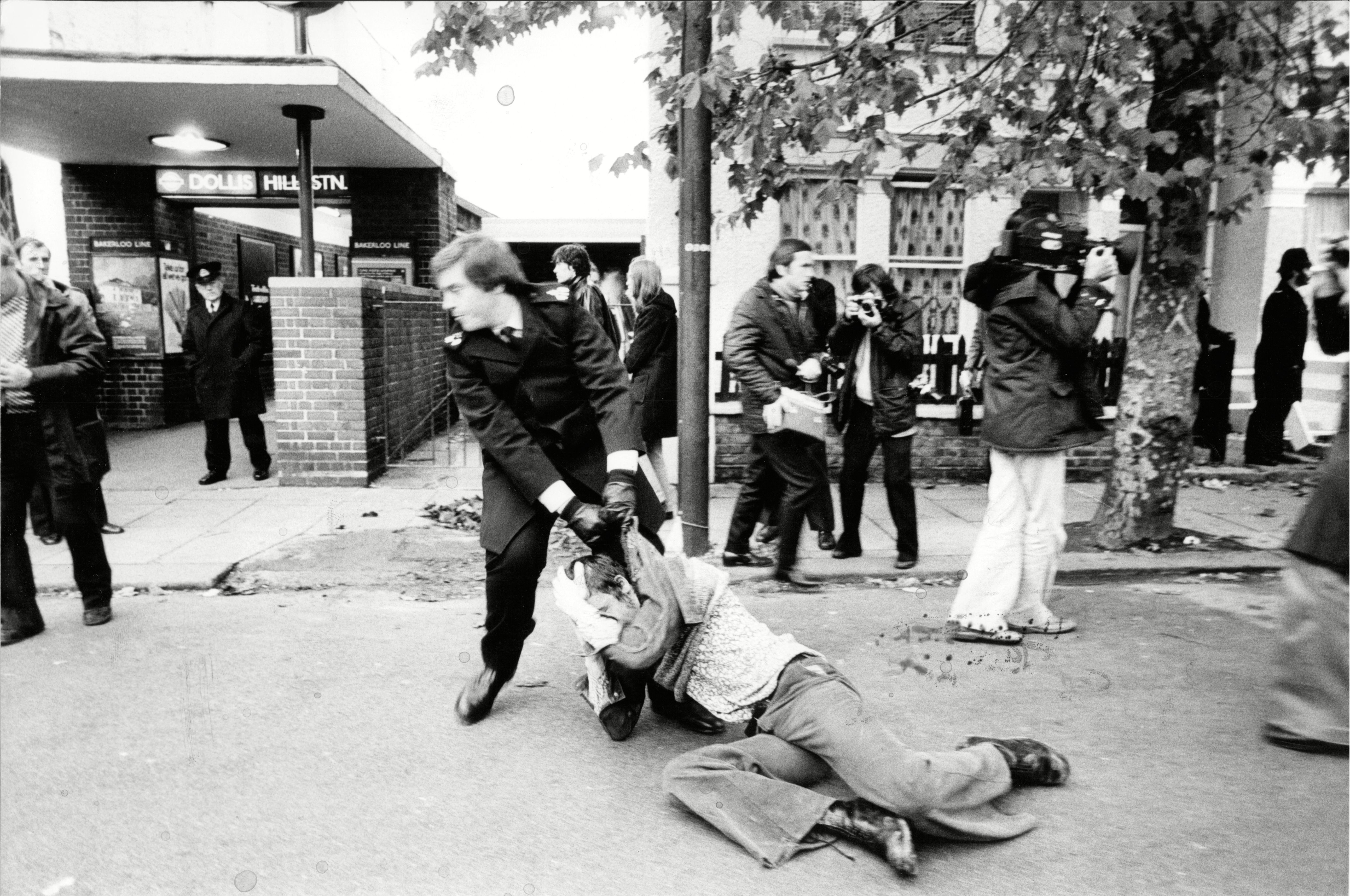 An Injured Picket Is Dragged Away By A Policeman In A Street Near The Grunwick Film Processing Lab In Willesden