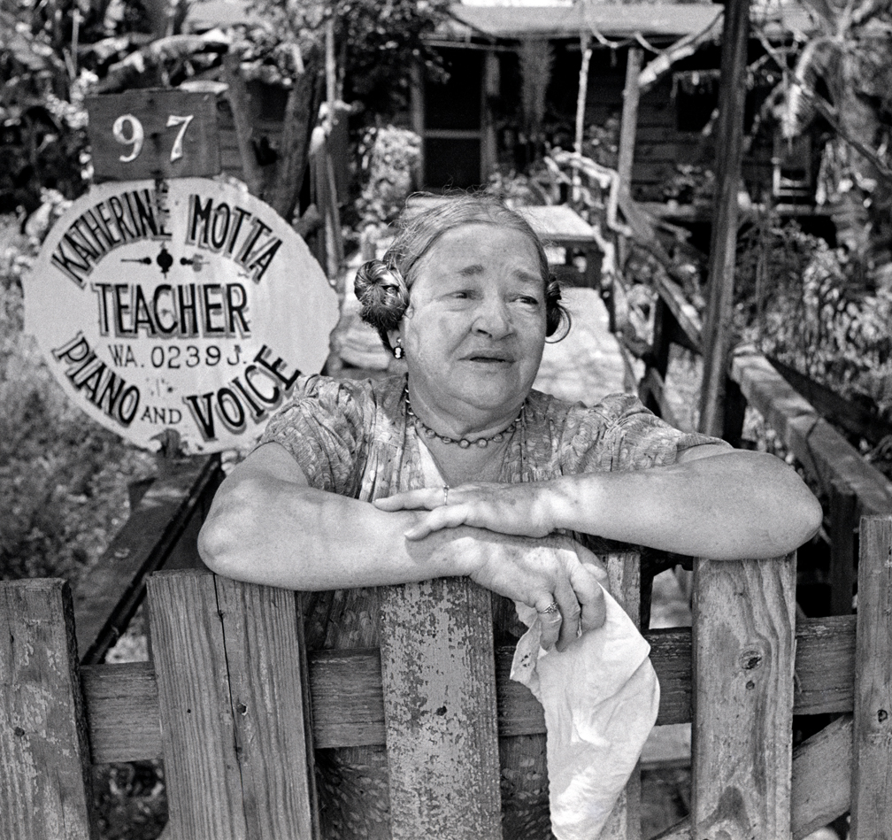 Music teacher Katherine Motta in front of her home, 1953