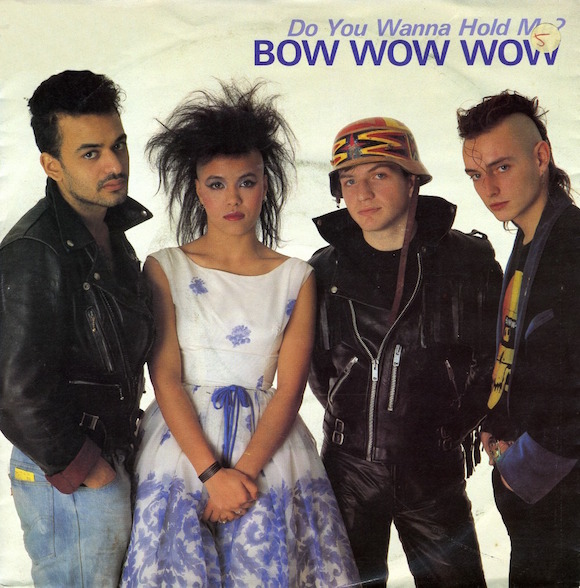 Front cover of 1983 Bow Wow Wow single released after McLaren quit managing the group. Design on helmet worn by bass-player Leigh Gorman (second right) combined the cross from the Fox design with the arrowheads from the Pawnee strap