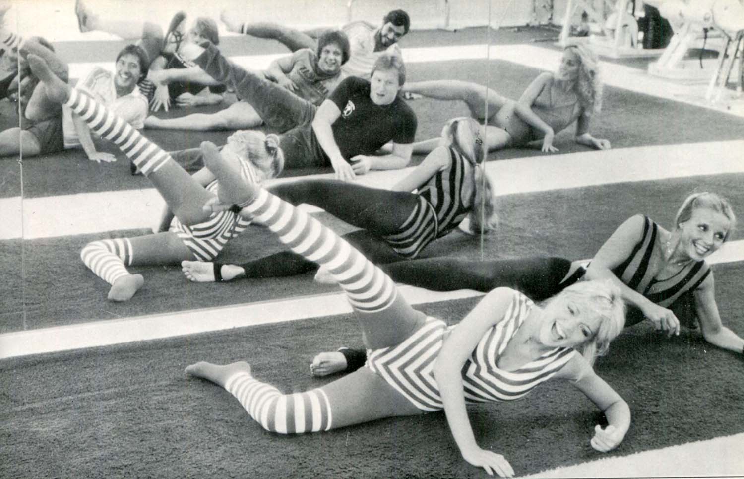 Let's get physical! Eighties-inspired aerobics class taking over gyms sees  devotees squatting and star-jumping in retro lycra leotards and leg-warmers