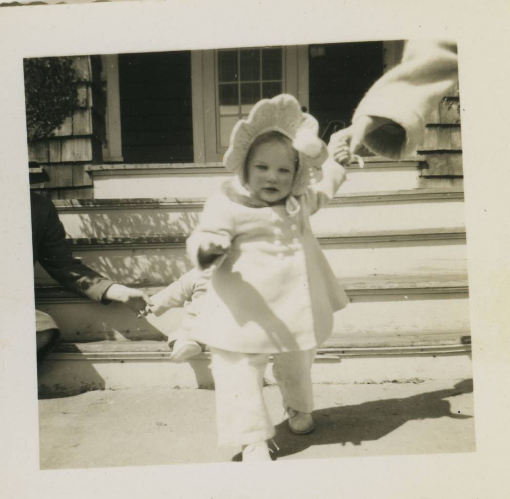 I think this is my contemporarily cousin, Diane Polhemus (my father's brother's eldest daughter) , Neptune City, New Jersey, USA - Easter, 1948. Diane's father Doug ran the gas station on the corner of Corlies Ave and South Main Street. My father Charles Polhemus had pulled out of being the co-owner of a corner shop in Neptune City on the grounds that his partner insisted they stay open on Sundays. And he never approved of the fact that his brother was always open on Sundays - but there were other, deeper, undercurrents of bad feeling between them: my father always said his brother over-charged him if he went there to have his car fixed. But Doug has a great, classic Coke machine and, on the walls of his office, calendars featuring pics of sexy girls.