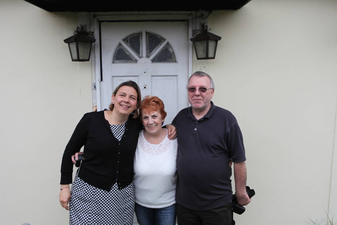 Elisabeth Blanchet, Rosemary Roffey and Alan Brine outside the prefab they grew up in on the Excalibur Estate, May 2014
