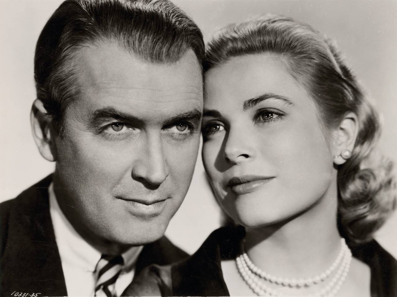 Portrait of James Stewart and Grace Kelly in Rear window directed by Alfred Hitchcock, 1954