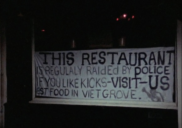 Sign in the window of the much-raided local Caribbean restaurant The Mangrove