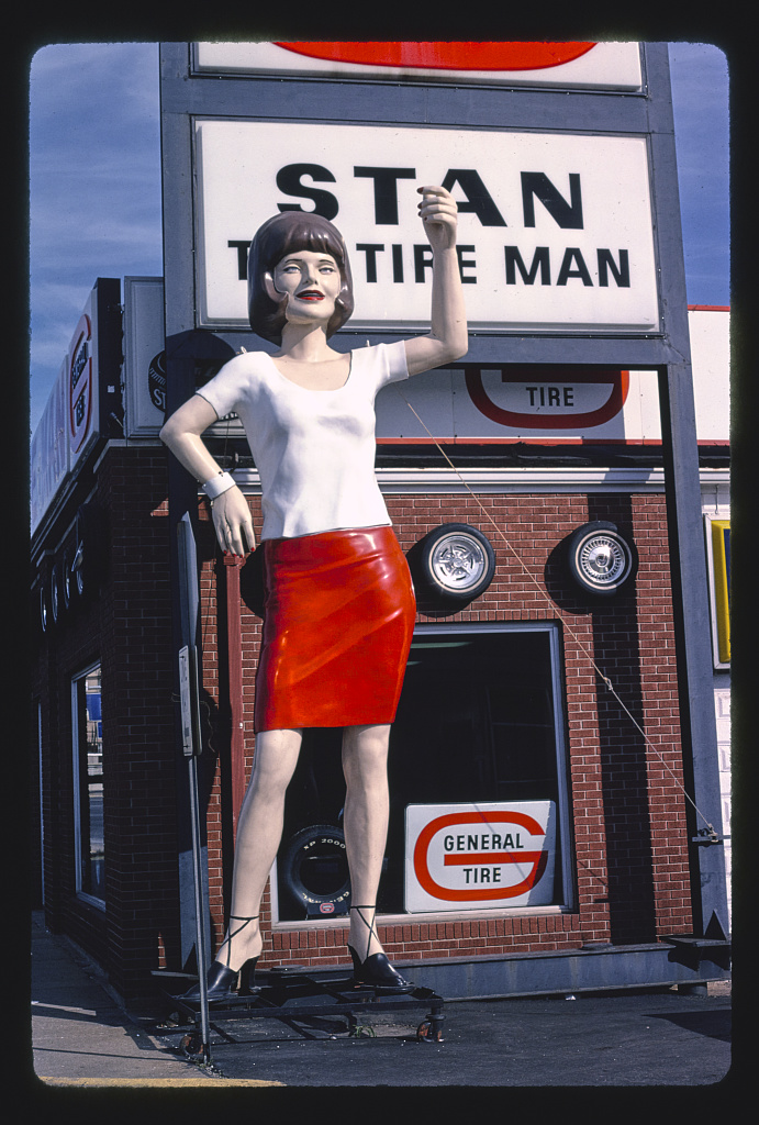 Stan The Tire Man statue, angle shot, Broadway 1984